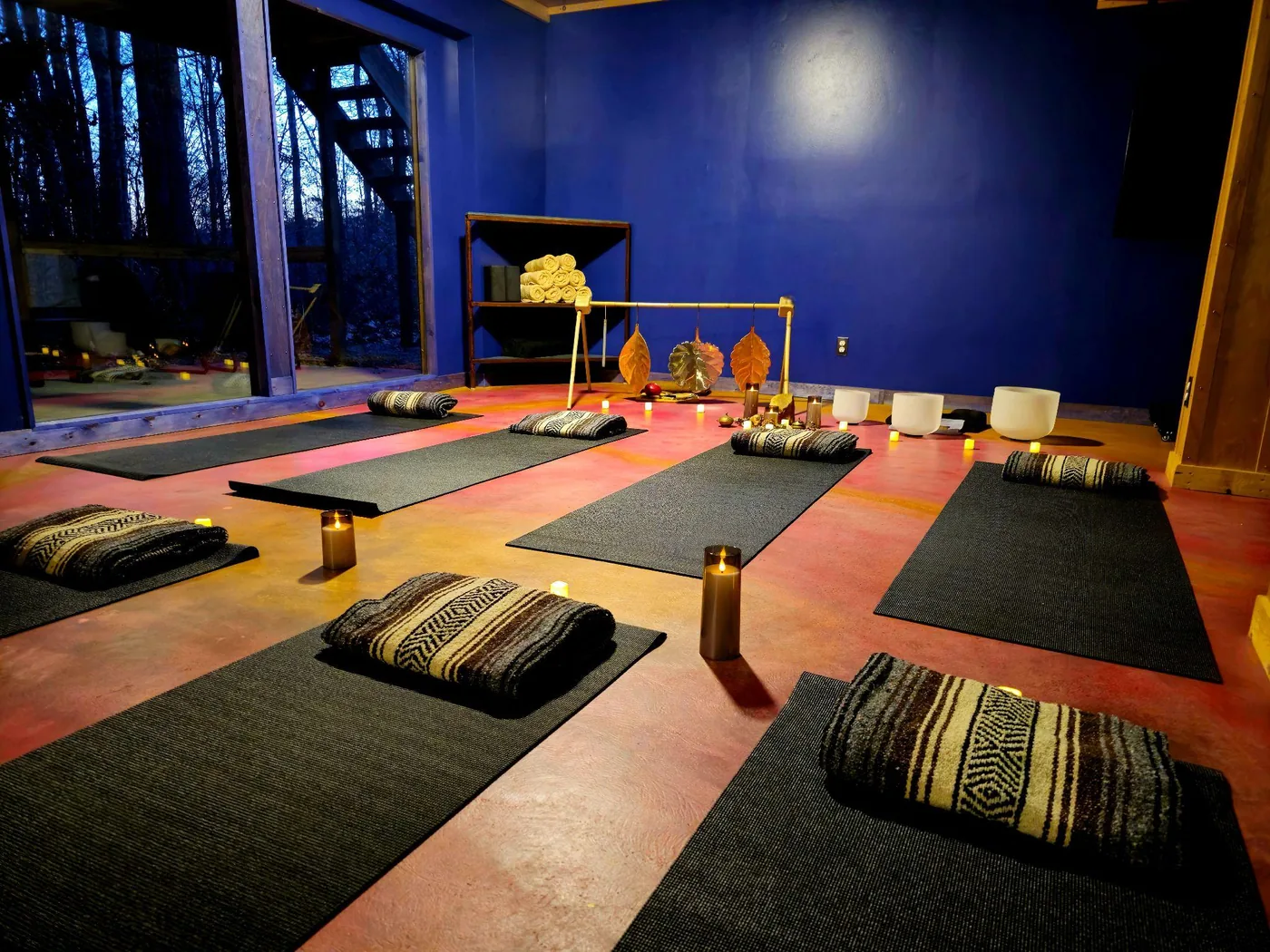 Yoga mats, cushions and candles set for a group wellness session in the Art Lodge at Raven’s Retreat Hocking Hills