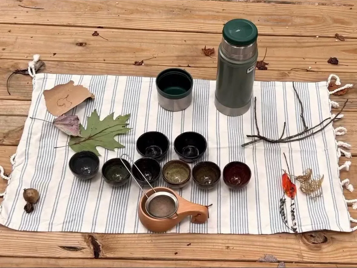 Tea ceremony set laid out on a wooden table after forest bathing at Raven’s Retreat Hocking Hills