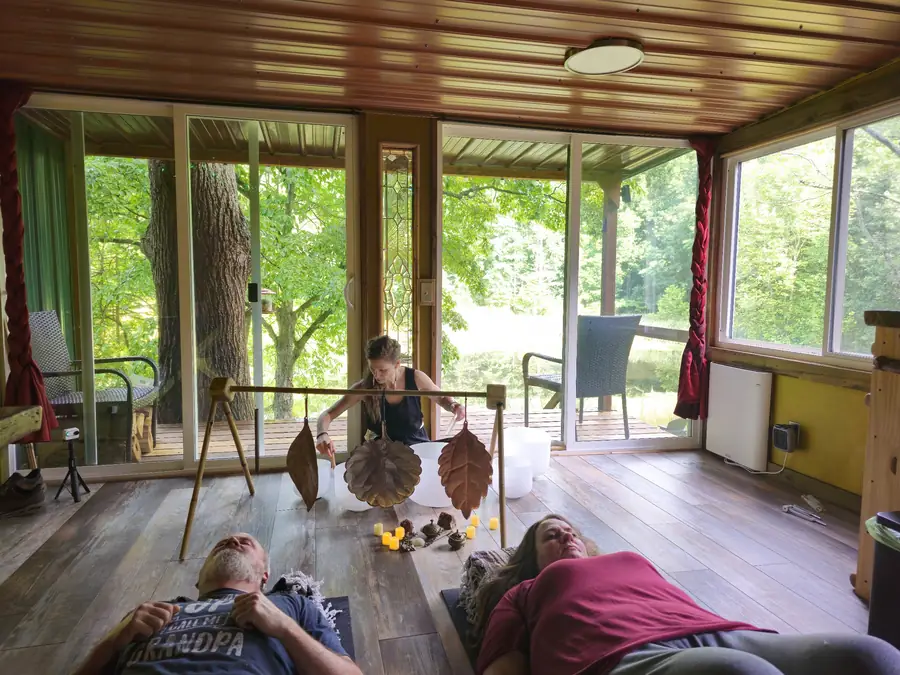 Couple during a reconnection retreat sound bath at the Art Bungalow