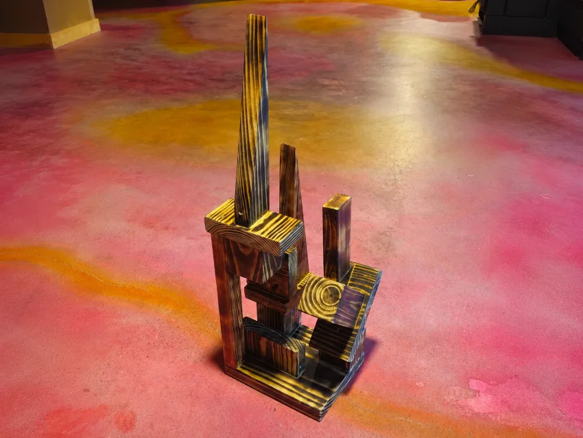 An original collaborative wood sculpture made during a group sculpture workshop