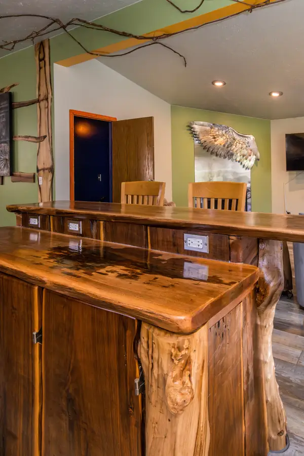 The group retreat space in the Art Lodge with its live-edge bar and seating