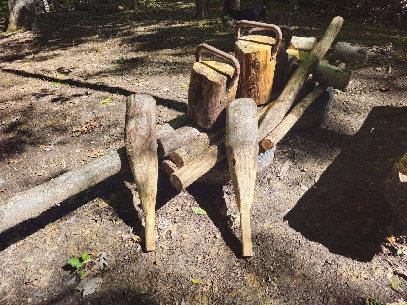 Hand-built wooden Indian clubs and logs on the fitness trail at Raven’s Retreat Hocking Hills