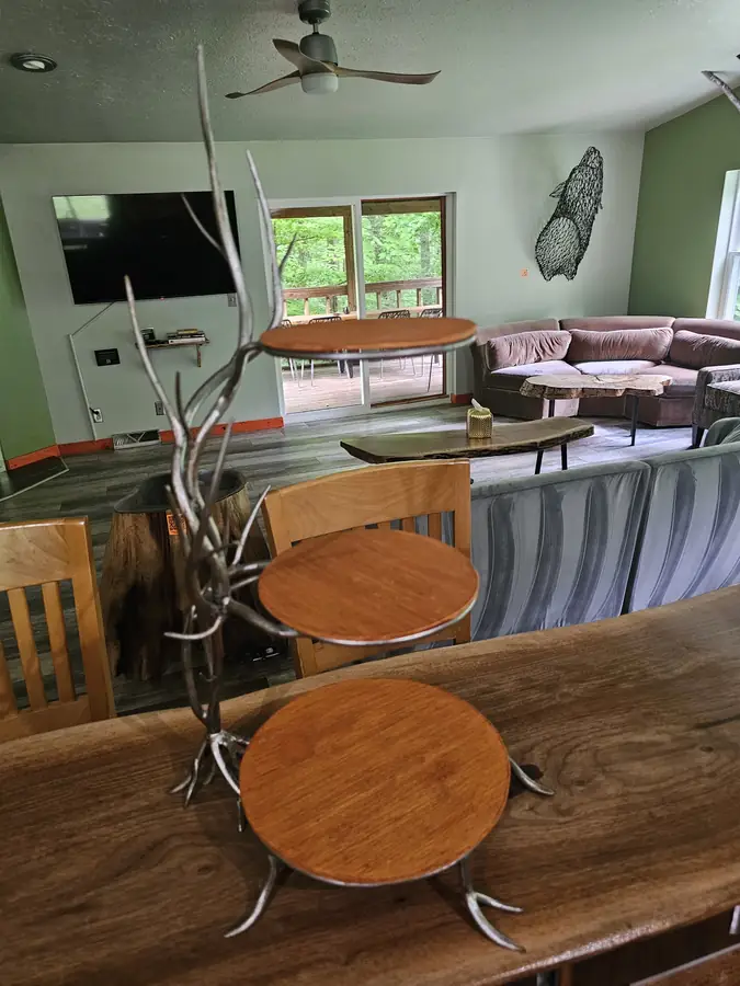 The Art Lodge living room seen from the kitchen, filled with original sculpture