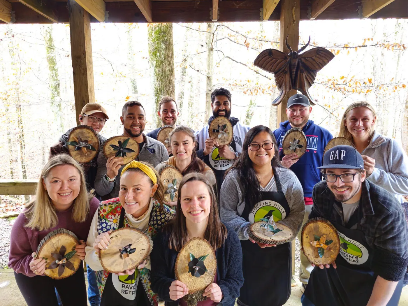 A group holding up the sculptures they made in a workshop at Raven's Retreat Hocking Hills