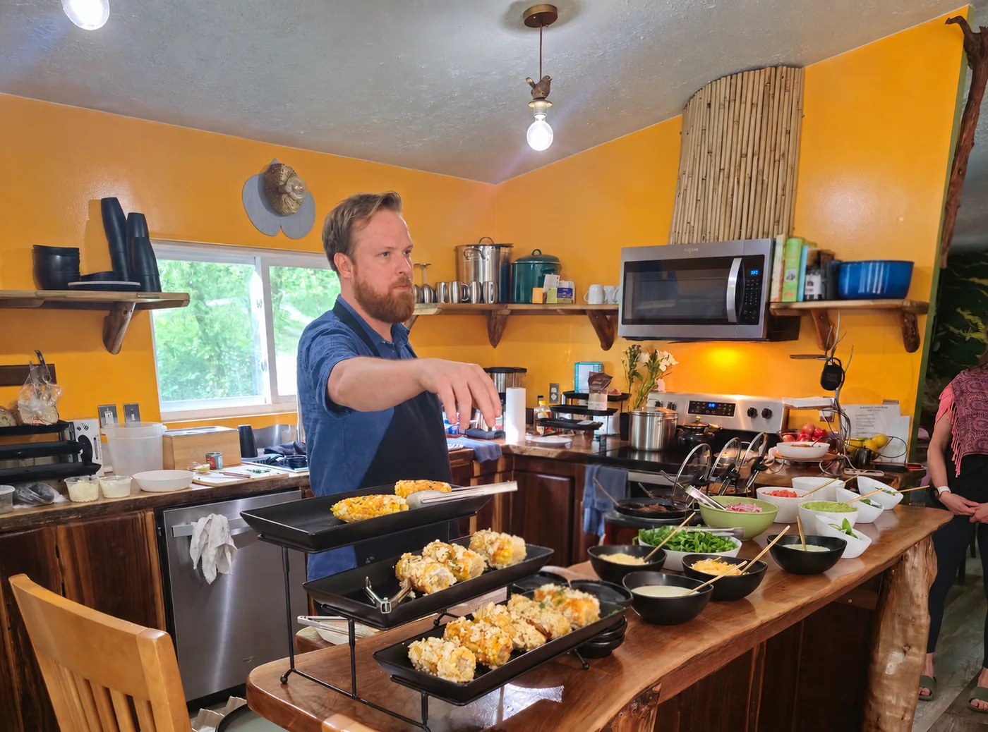 Private chef plating a celebration meal in the kitchen at Raven’s Retreat Hocking Hills
