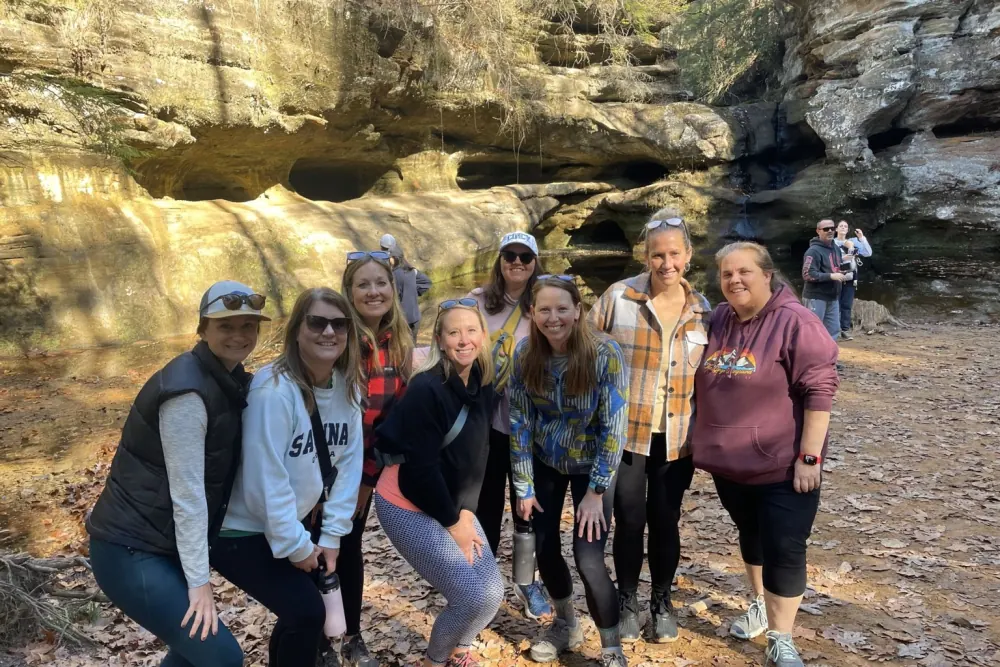 A women's retreat group on a hike to the rock caves of Hocking Hills