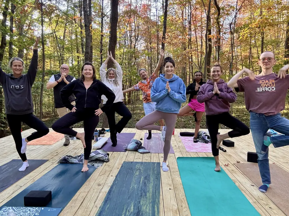 Yoga on forest platform on wellness trail at Raven’s Retreat Hocking Hills
