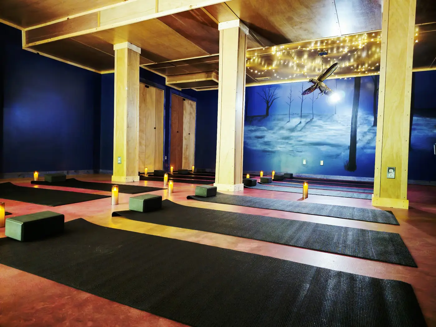 The indoor yoga shala at the Art Lodge with mats, bolsters and candlelight, Raven's Retreat Hocking Hills